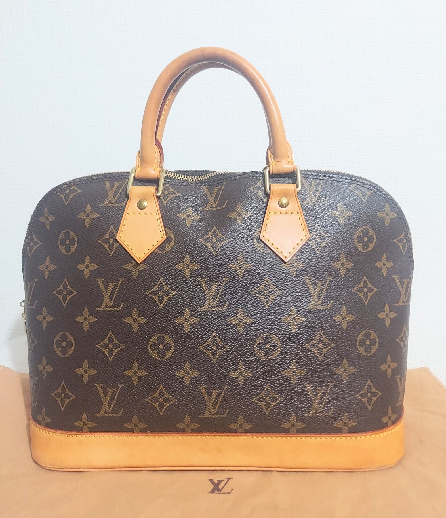 Louis Vuitton Alma Handbag