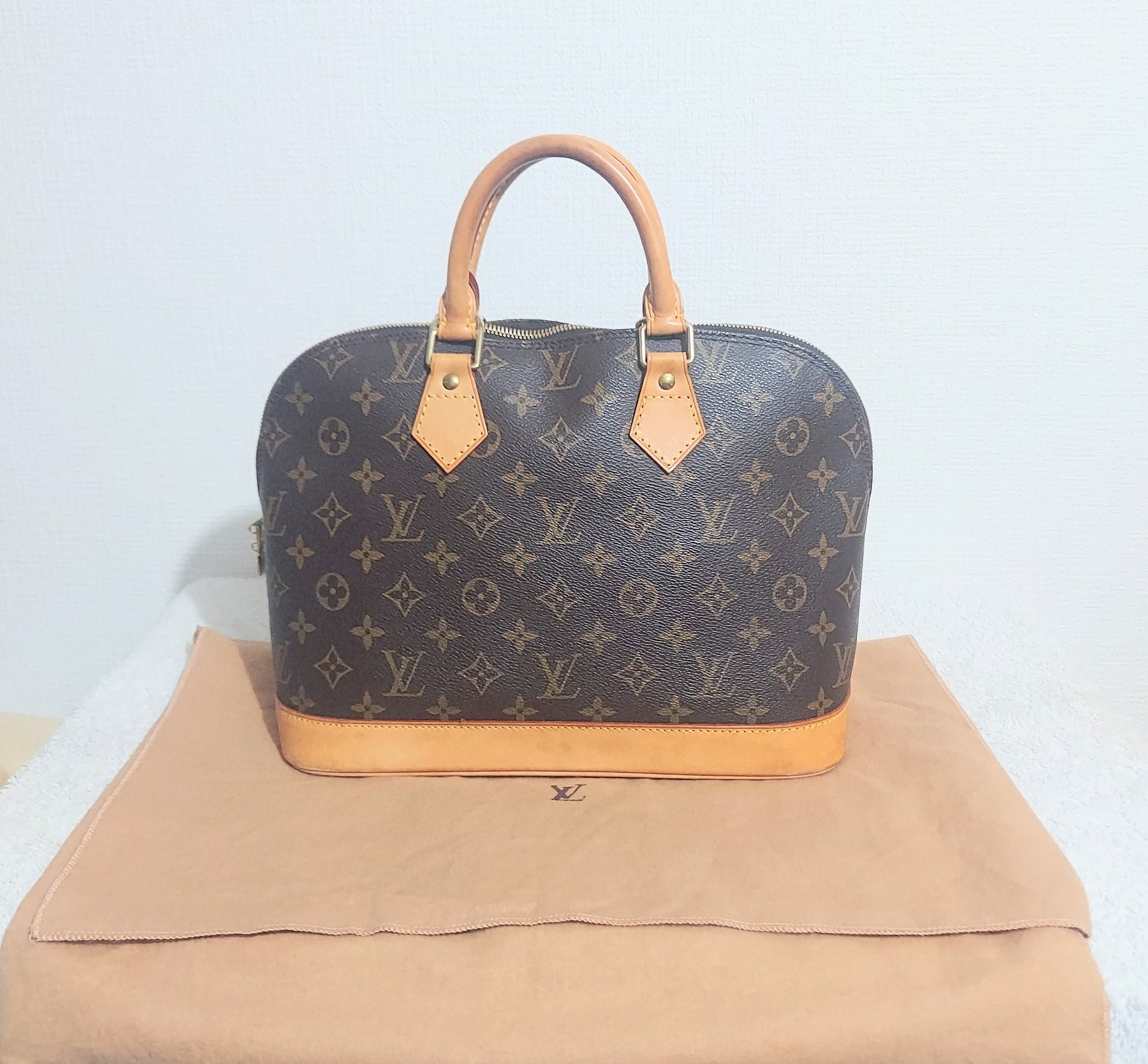 Louis Vuitton Alma Handbag
