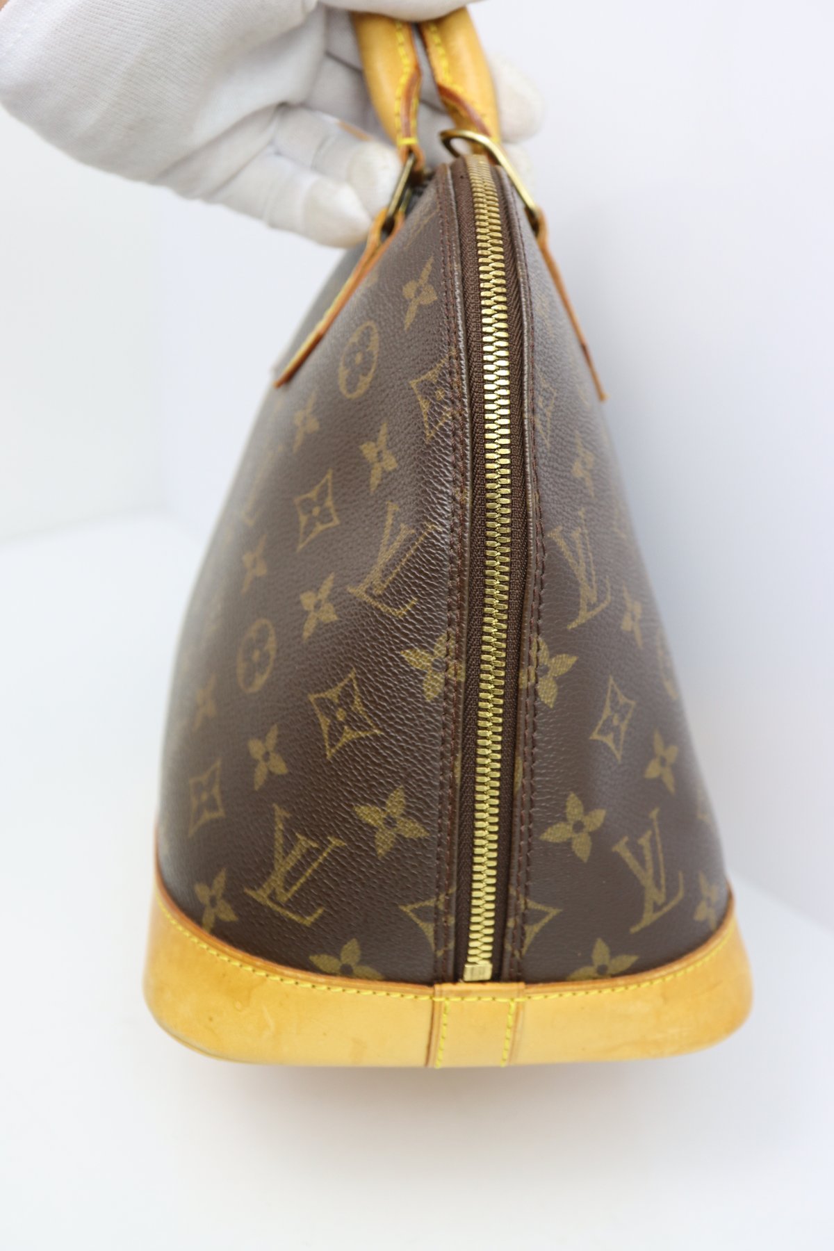 Louis Vuitton Canvas Monogram Alma Handbag